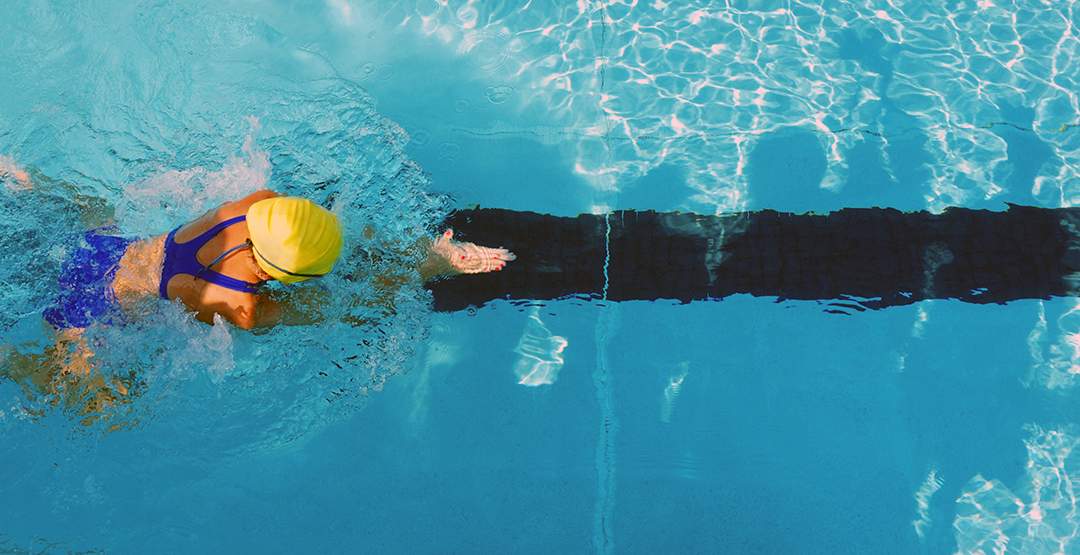 woman doing the breaststroke in a swimming pool