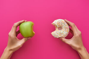 eating healthy - donut vs apple - Nutrition enhancement At AlignLife