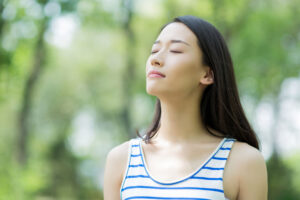 girl breathing fresh air in park