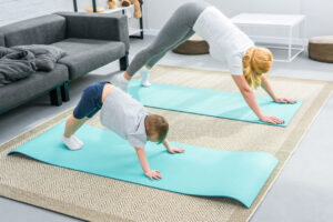 mom and kid doing yoga