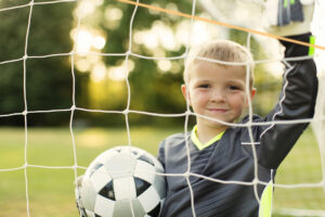 boy playing soccer - summer sports