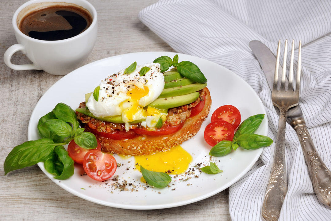 healthy breakfast - poached egg and avocado on toast