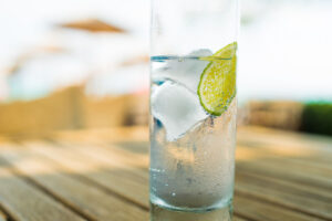 glass of cold ice water with lime