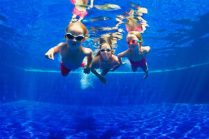 water safety - family diving underwater