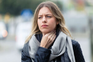 woman with sore throat