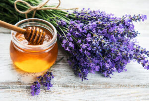 Jar with honey and fresh lavender