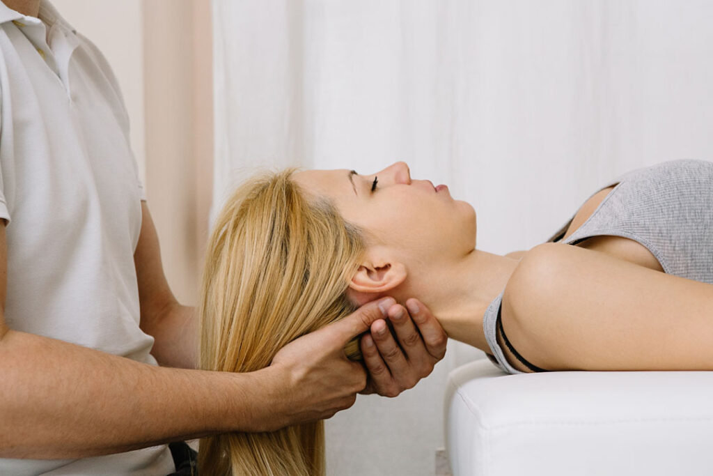 woman getting a chiropractic neck adjustment