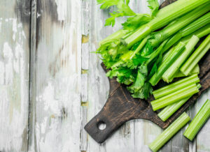 Fresh celery on a cutting Board.