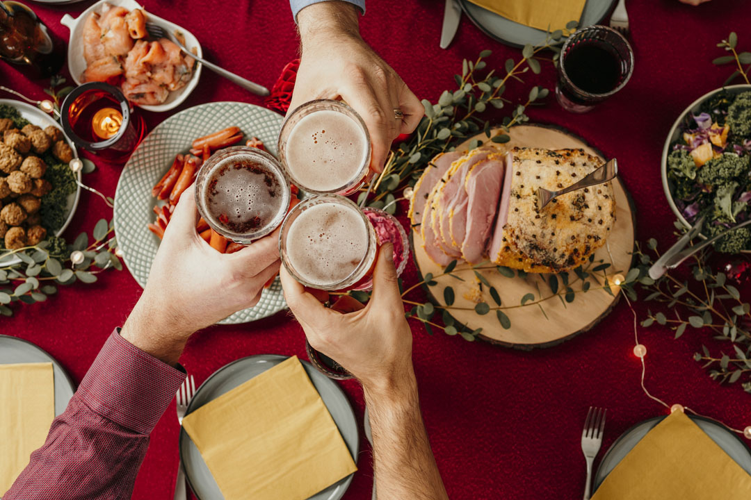 Christmas food smörgåsbord people toasting in beer