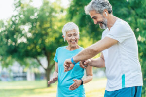 Senior couple using sports technologies