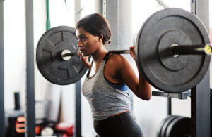 woman weightlifting heavy weights squats