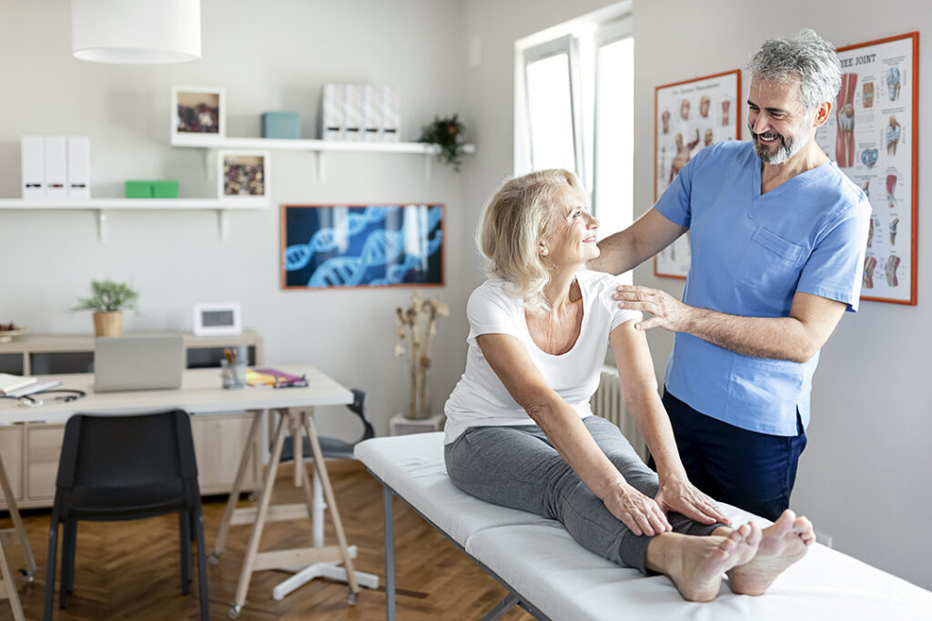 Chiropractor Examining Female Senior Patient - bone health - osteoporosis