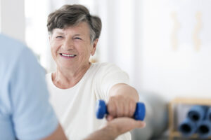 Senior woman exercising with weights