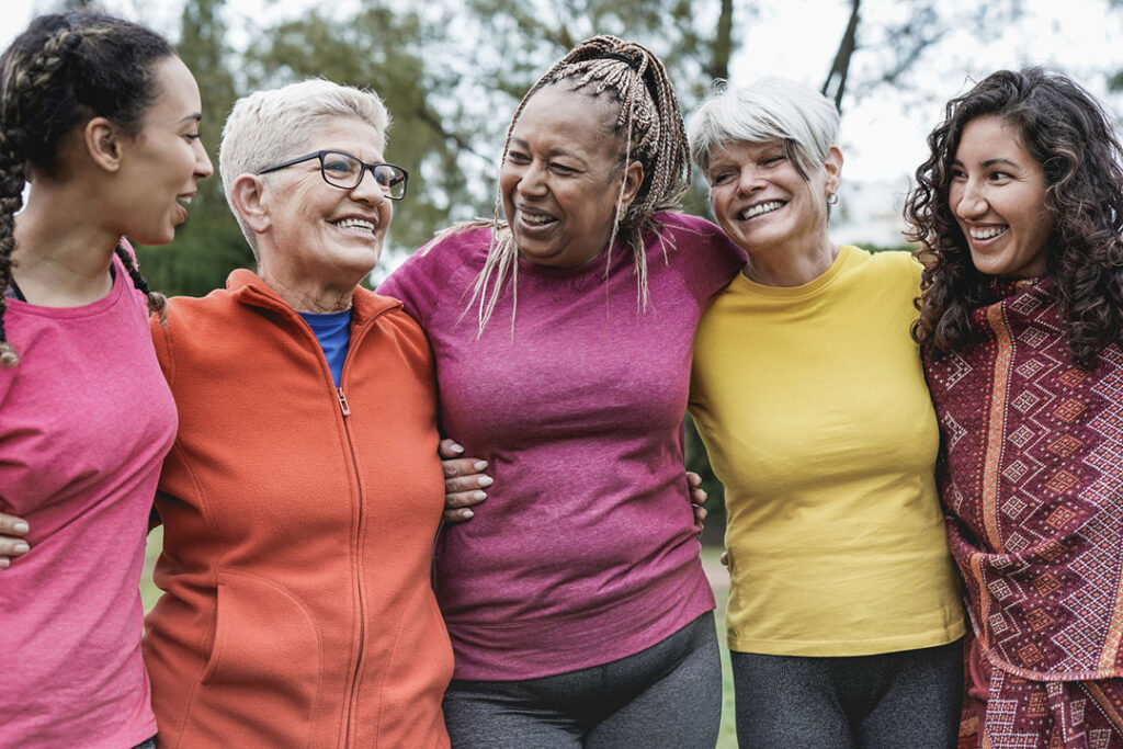 Multi generational women having fun together at park - Multiracial