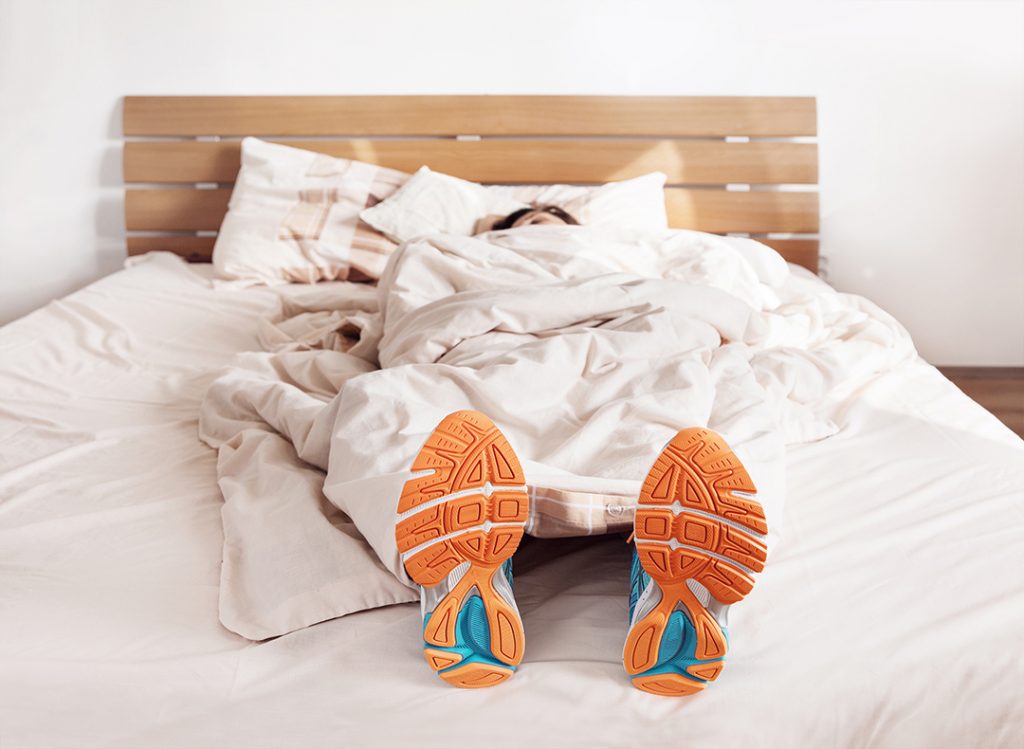 running with shoes on sleeping in bed