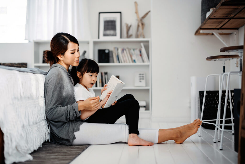 mom and child focusing on reading