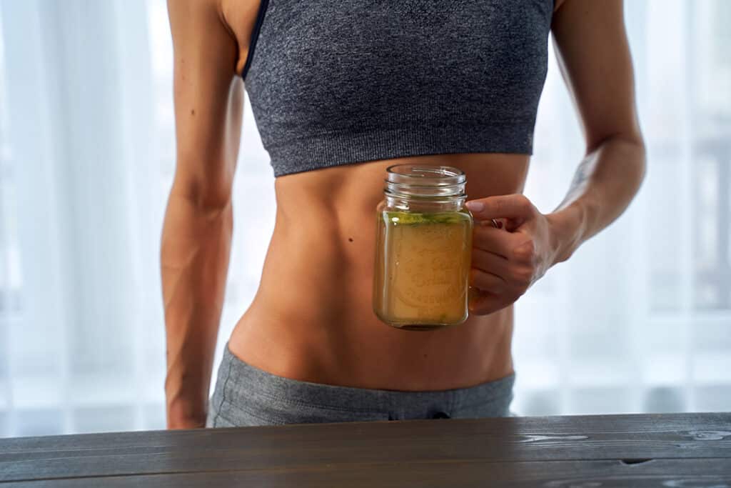 woman drinking bone broth