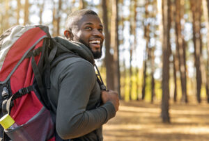 Man wearing back pack outside hiking