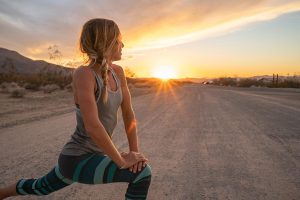 woman stretching after jogging