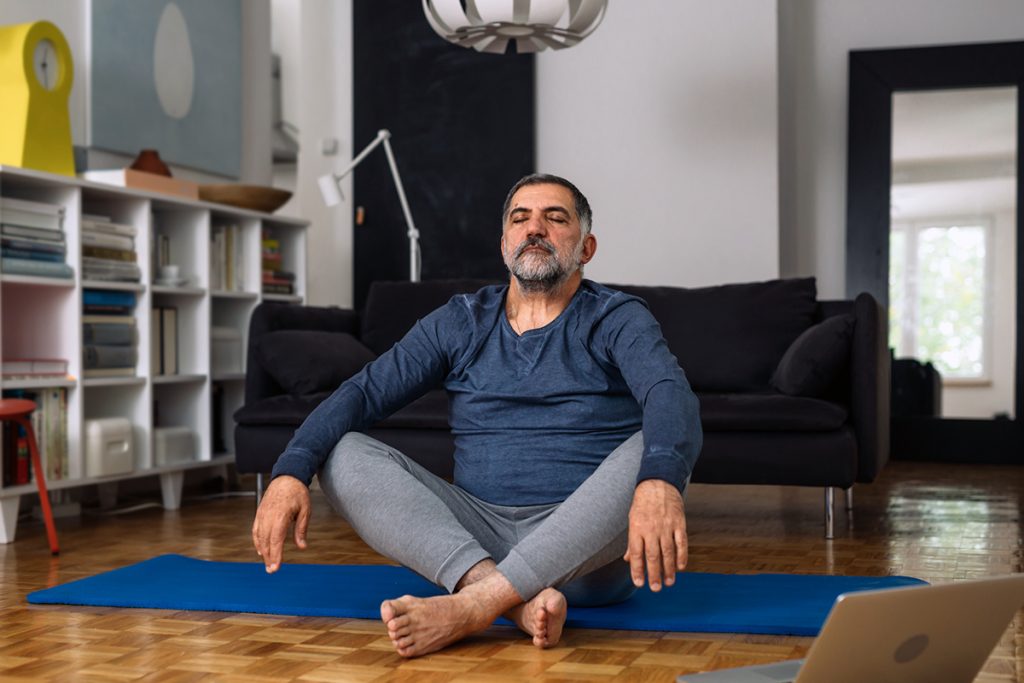 man doing yoga meditations