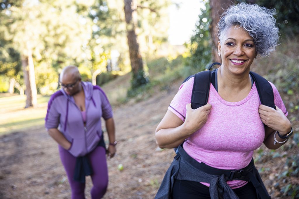 two mature black women getting exercise hiking