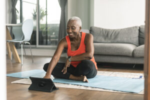 woman taking a yoga class online