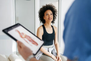 woman talking to chiropractor