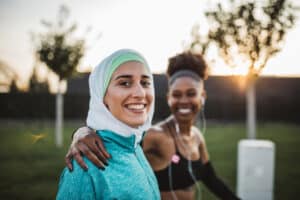 two women outdoor excercising with good posture - improving posture