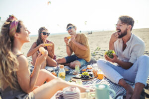 friends eating healthy on a beach vacation