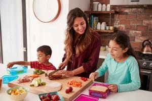 mom making healthy lunches with kids