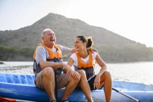 father and daughter out on a yakak - summer exercise active play