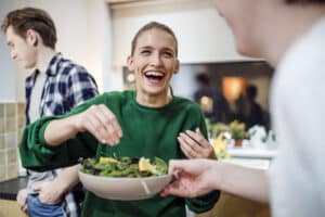 woman enjoying a gluten-free salad at home