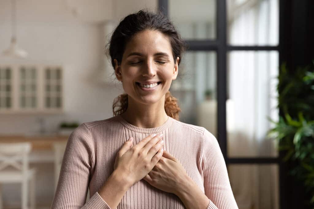 woman doing calming exercise to fight overwhelm