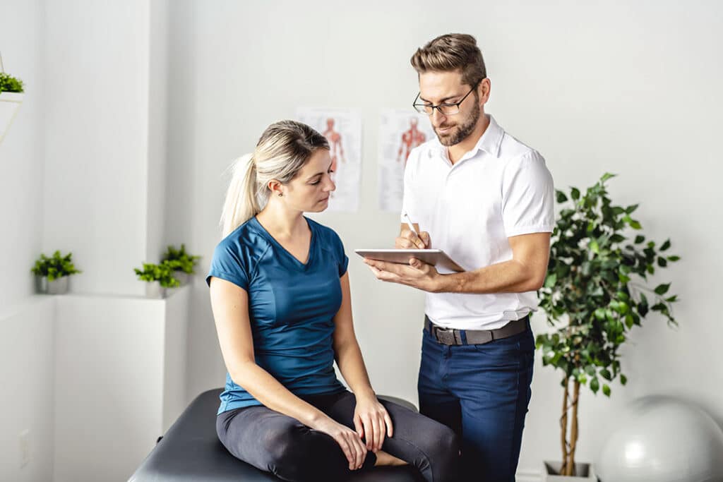 young woman talking to a health practitioner on how to detox the body with exercise