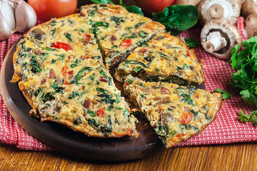 egg frittata with mushrooms, spinach, onion, and red pepper