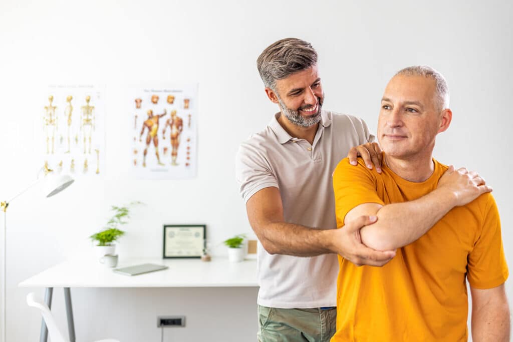 man working with chiropractor to get neck pain relief