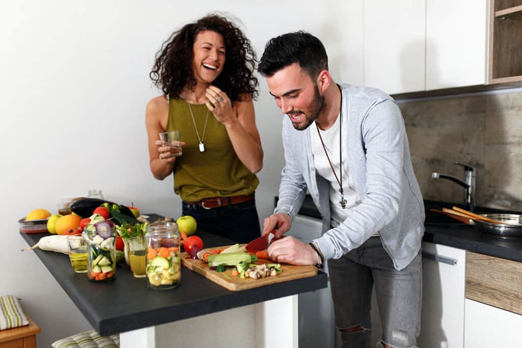 couple preparing foods together in a kitchen - foods rich in magnesium