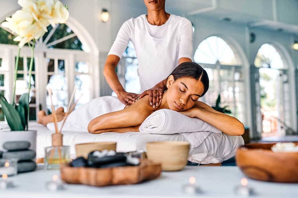 Woman having a spa massage - massage therapy vs spa massage