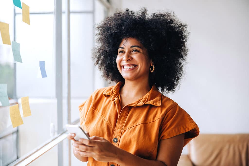 happy woman feeling refreshed and recharged from burnout symptoms