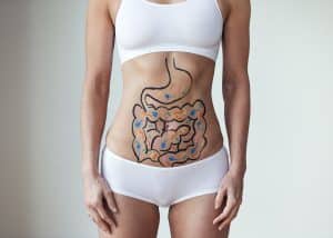 woman with gut illustration drawn on stomach - gut health, probiotics and prebiotics