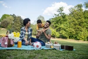 family having fun on a spring day picnic - fun things to do with family