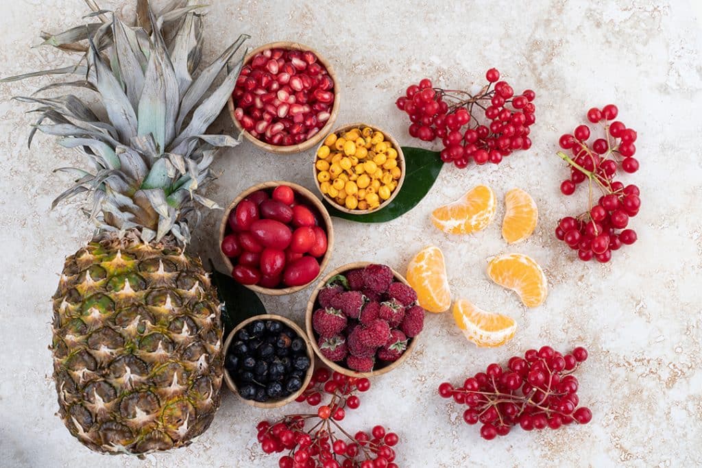 Various fruits like pineapple, berries, and oranges - Natural Antihistamines