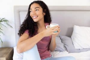 Woman holding cup of tea - spring allergy natural relief