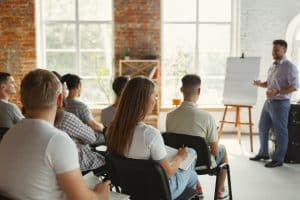 AlignLife Corporate Wellness - Guest Speaker talking to a group of employees at a company