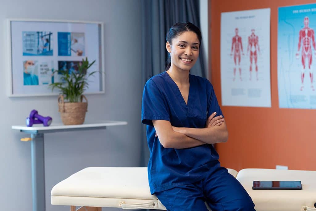 female chiropractor sitting in office