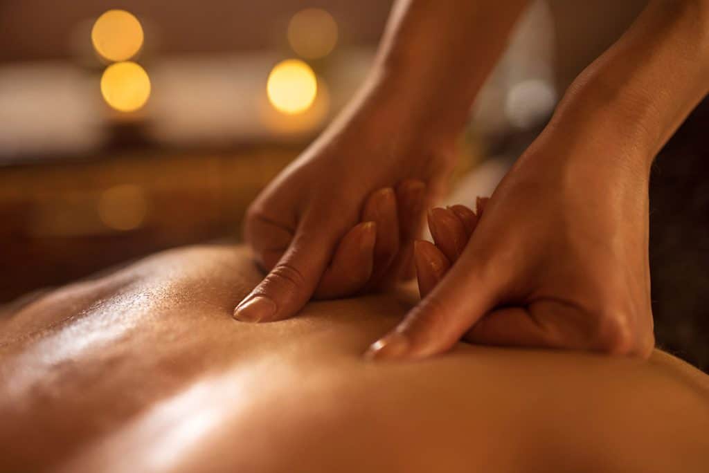 Close up of therapeutic massage therapy session on man's back