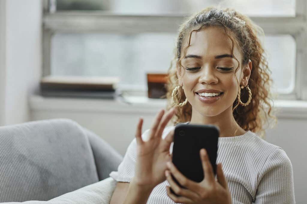 Woman applying for CareCredit on her smart phone