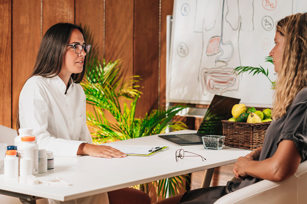 woman working with nutritionist on incorporating more fiber into diet for better digestive health