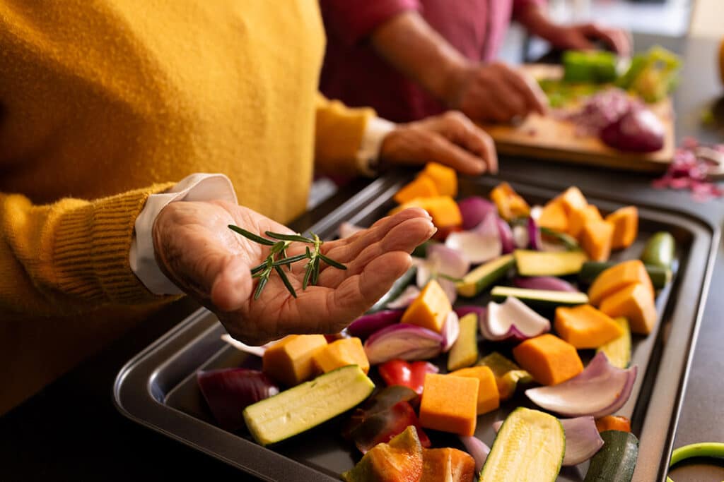 Woman cooking with heart healthy foods