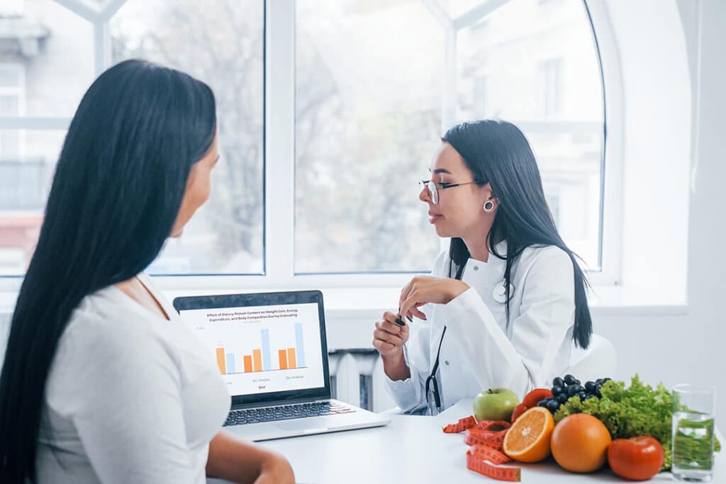 Woman meeting with nutritionist for heart healthy foods